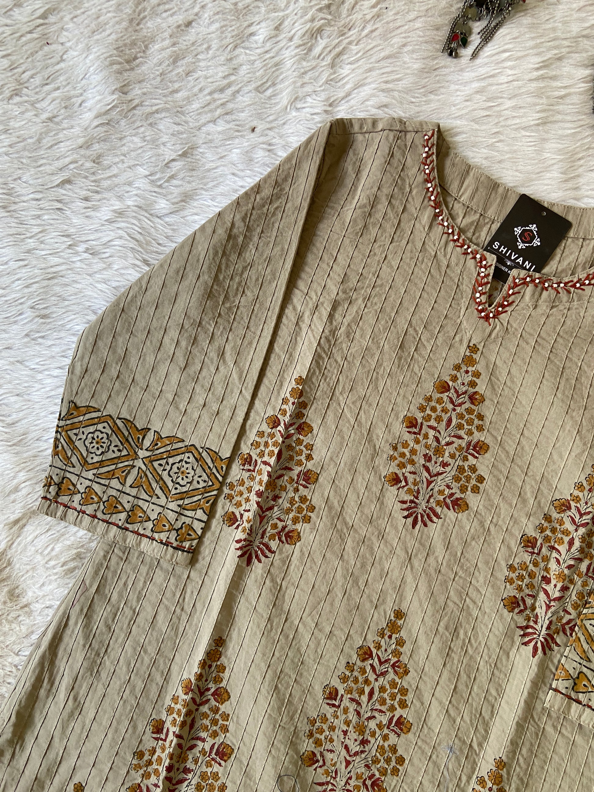 Folded fabric with floral patterns on a textured surface
