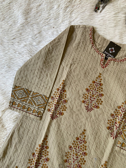 Folded fabric with floral patterns on a textured surface