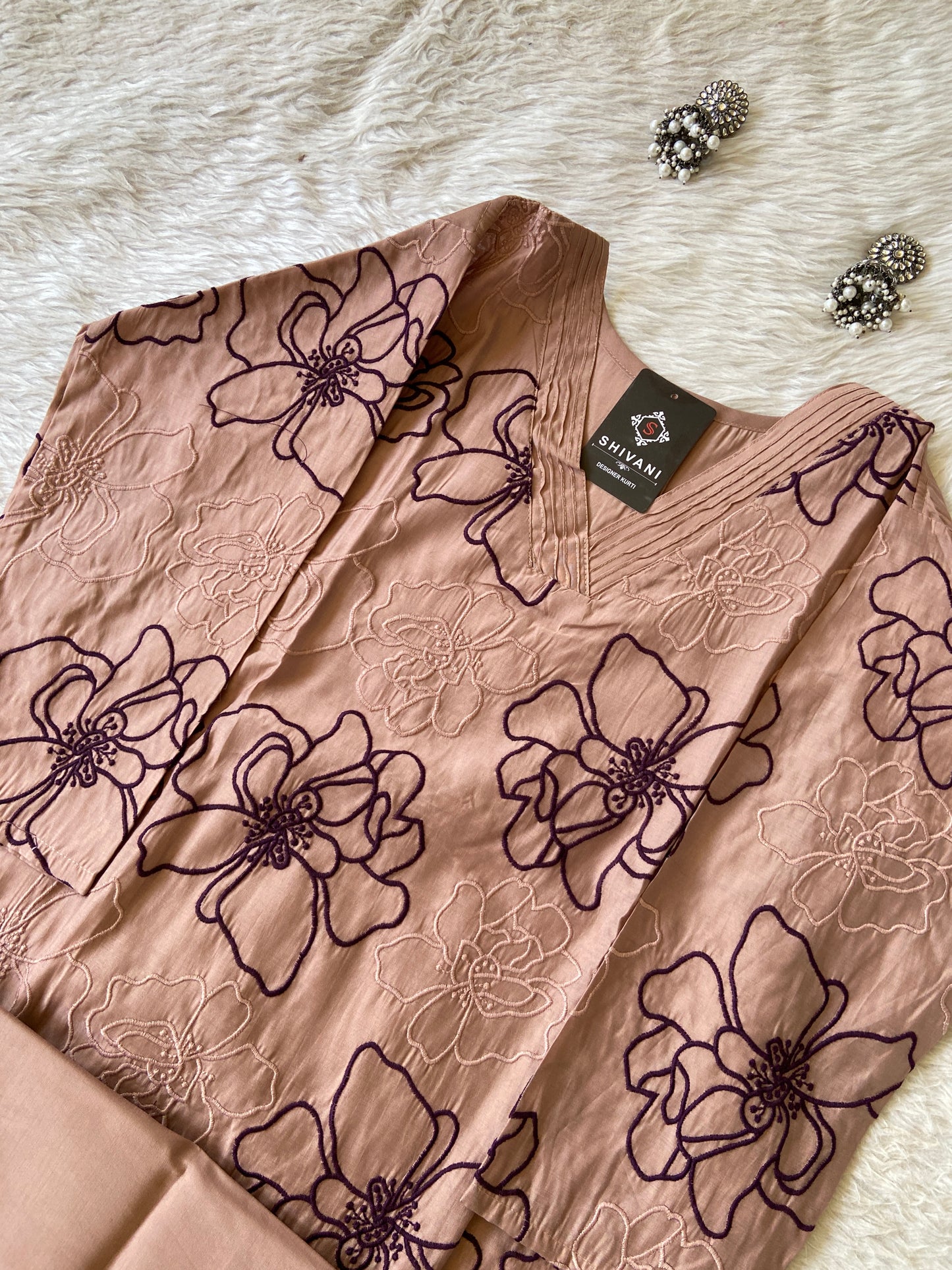 Lace fabric with floral patterns on a white surface