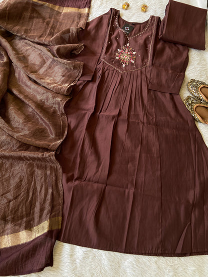 Brown fabric with decorative elements on a textured surface
