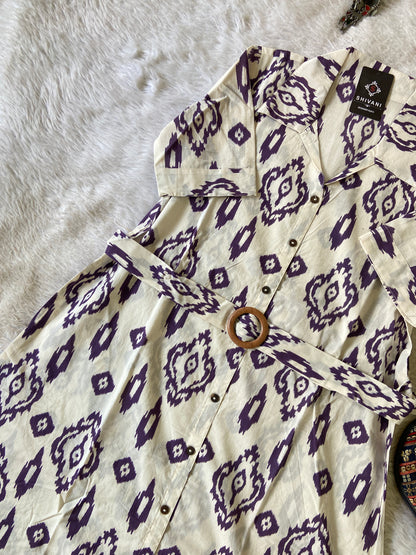 Shirt with purple geometric pattern on a white surface