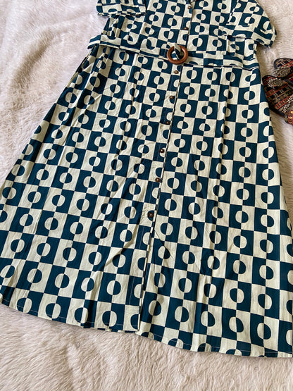 Folded fabric with a blue and white geometric pattern on a textured surface